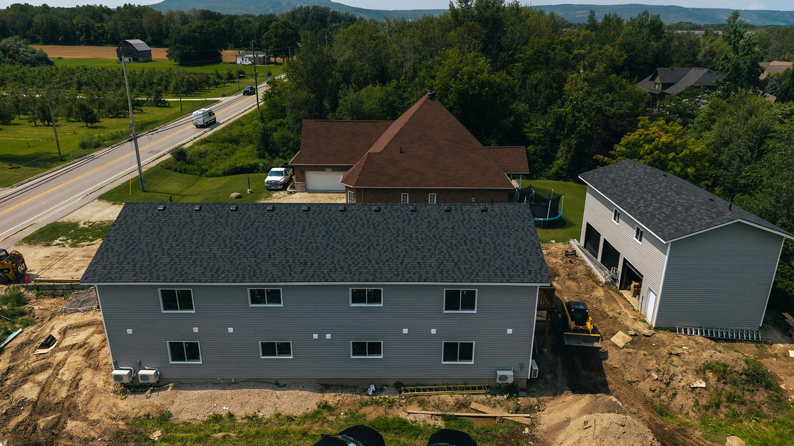 Aerial view of the finished building at Poplar Sideroad with the escarpment beyond